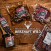 Vatertagspaket Herzhaft Wild mit Hirschsteaks, Wildsnacks und Grillschürze